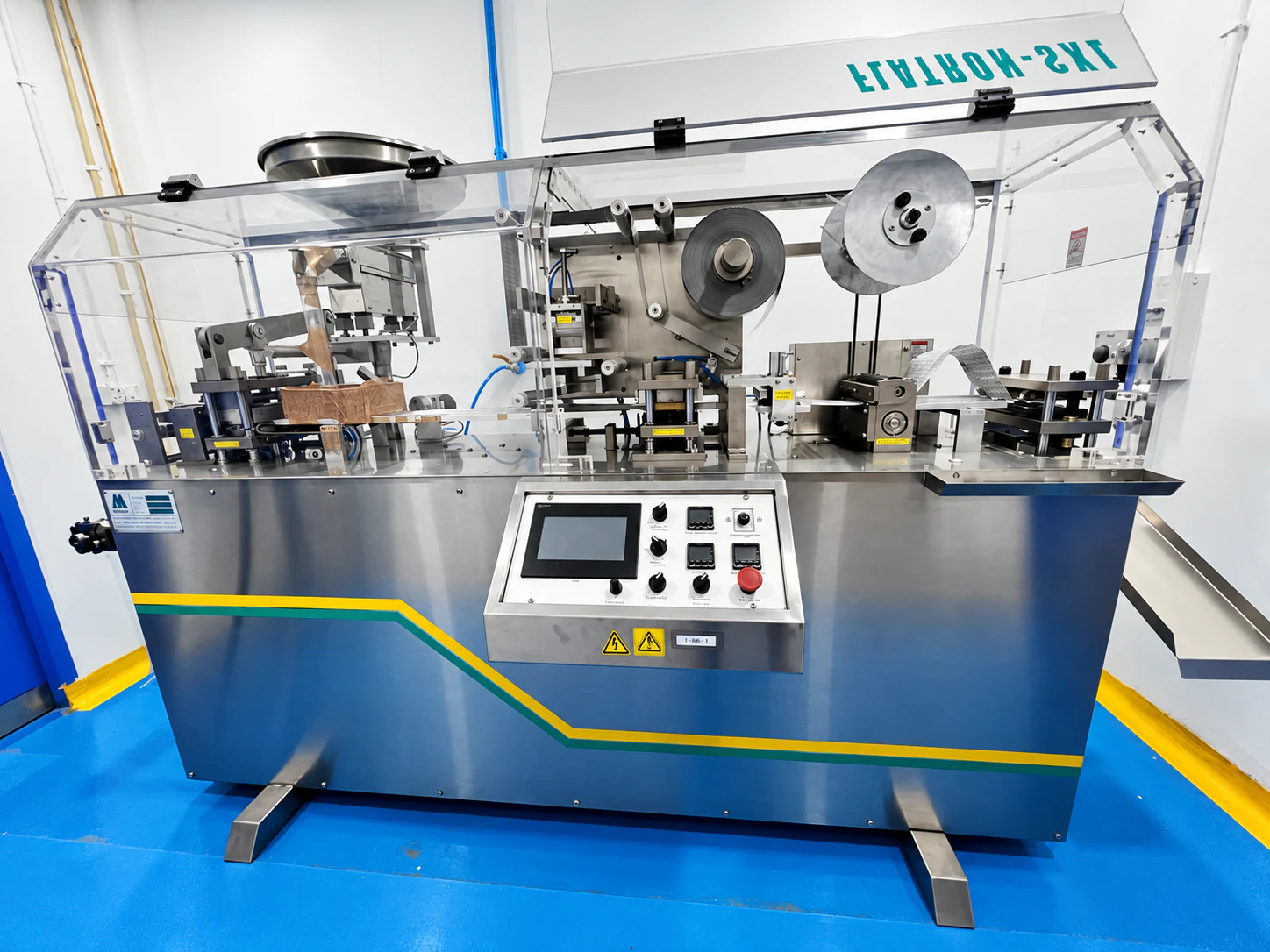 Enclosed stainless-steel packaging machine on the Healthy Health production floor