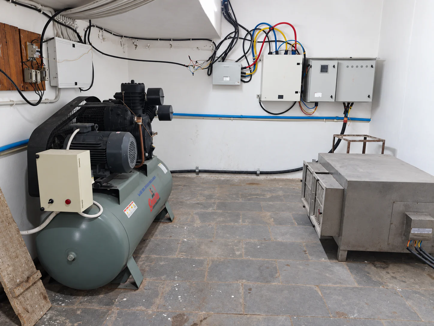 Compressor, electrical panels and supporting utility systems inside the Healthy Health facility